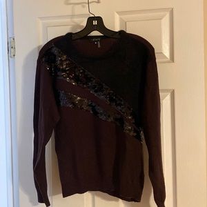 1. State Eggplant and Black sweater sequins across the front. Size Medium